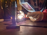 a welder working on a piece of metal